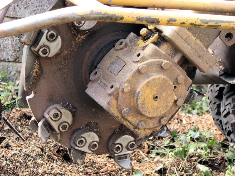 Stump grinder cutting wheel in the ground